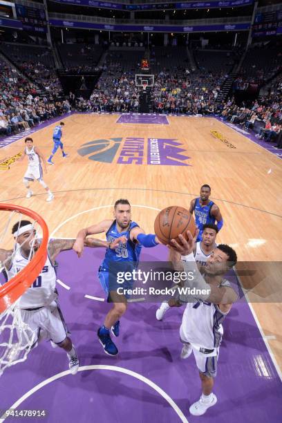 Skal Labissiere of the Sacramento Kings rebounds against Salah Mejri of the Dallas Mavericks on March 27, 2018 at Golden 1 Center in Sacramento,...