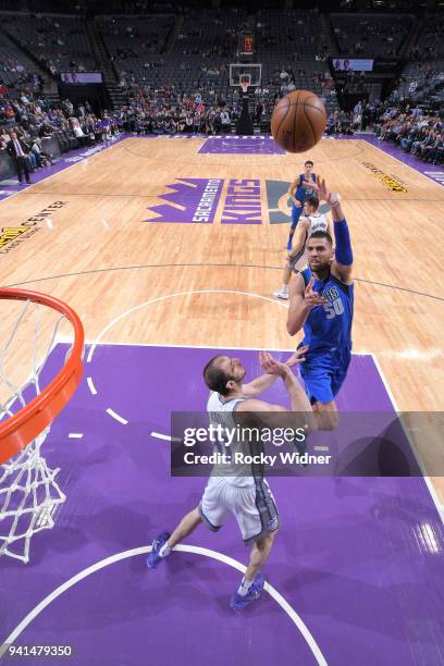 Salah Mejri of the Dallas Mavericks shoots against Kosta Koufos of the Sacramento Kings on March 27, 2018 at Golden 1 Center in Sacramento,...