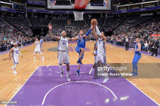 Skal Labissiere of the Sacramento Kings rebounds against Salah Mejri of the Dallas Mavericks on March 27, 2018 at Golden 1 Center in Sacramento,...
