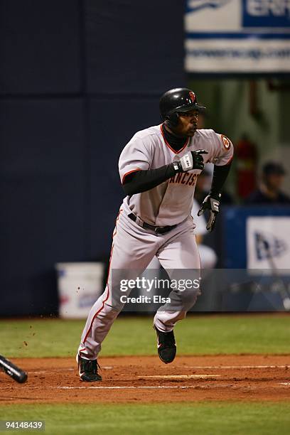 Michael Tucker of the San Francisco Giants runs to first against the Minnesota Twins during the game on June 15, 2005 at the Hubert H. Humphrey...