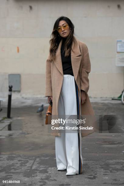 Fashion blogger Felicia Evalina wears Zara trousers, Day Birger et Mikkelsen coat, Chimi sunglasses, Kitri top, Alexandra de Curtis bag and Kurt...