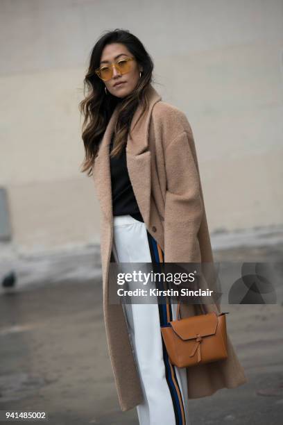 Fashion blogger Felicia Evalina wears Zara trousers, Day Birger et Mikkelsen coat, Chimi sunglasses, Kitri top, Alexandra de Curtis bag day 4 of...