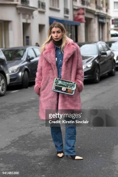 Editor in chief of MINT Irina Lakicevic wears a Hope jacket, Chanel bag and Céline boots day 4 of Paris Womens Fashion Week Spring/Summer 2018, on...