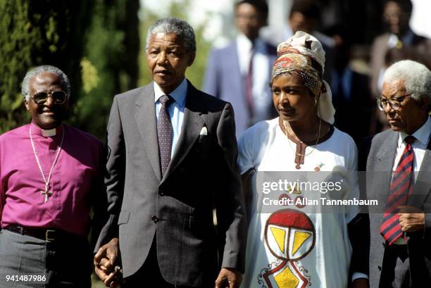 Portrait of, from left, Bishop Desmond Tutu, married anti-apartheid activists Nelson Mandela and Winnie Mandela , and African National Congress...