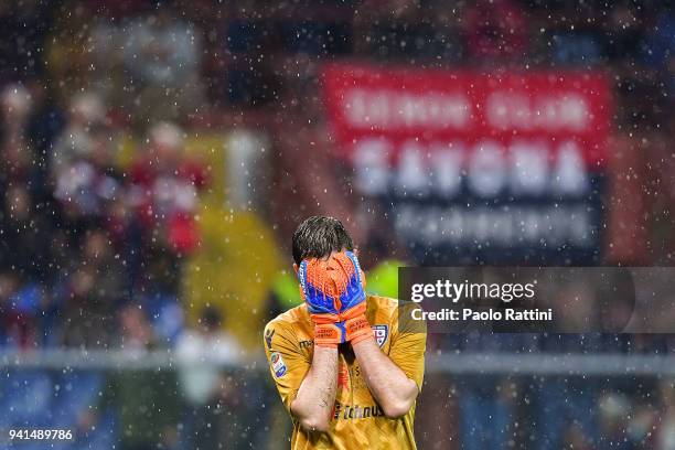 Alessio Cragno of Cagliari reacts with disappointment after Iuri Jose Picanco Medeiros of Genoa has scored a late-minute winning goal during the...