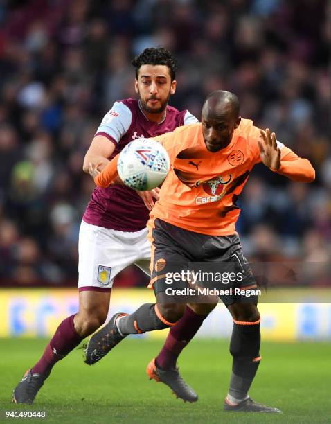 Sone Aluko of Reading is challenged by Neil Taylor of Aston Villa during the Sky Bet Championship match between Aston Villa and Reading at Villa Park...