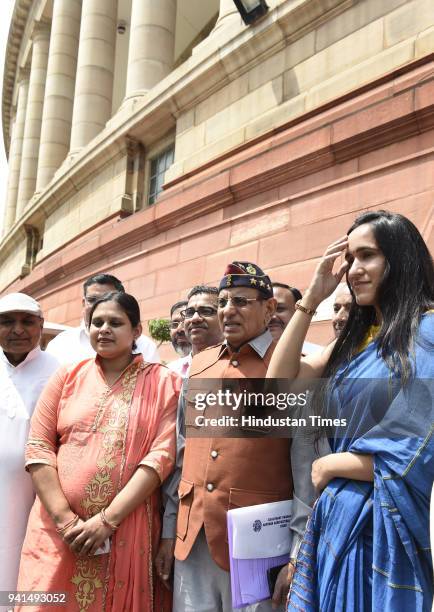 Newly elected BJP Rajya Sabha MP Devender Paul Vats with his family at Parliament House on April 3, 2018 in New Delhi, India. The proceedings of the...