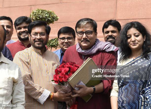 Newly elected RJD Rajya Sabha MP Manoj Jha welcomed by party leaders Jai Prakash Narayan at Parliament House on April 3, 2018 in New Delhi, India....