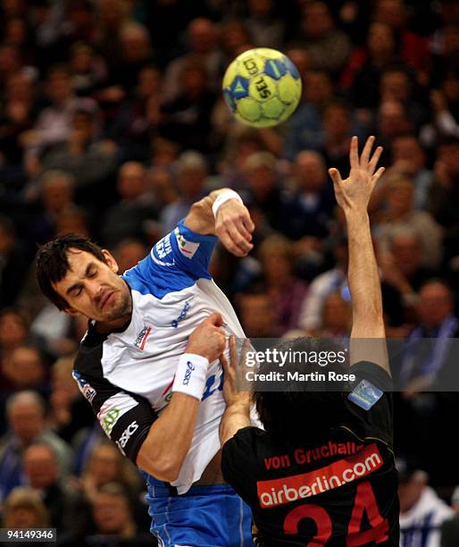 Marcin Lijewski of Hamburg and Florian van Gruchalla of Duesseldorf compete for the ball during the Bundesliga match between HSV Hamburg and HSG...