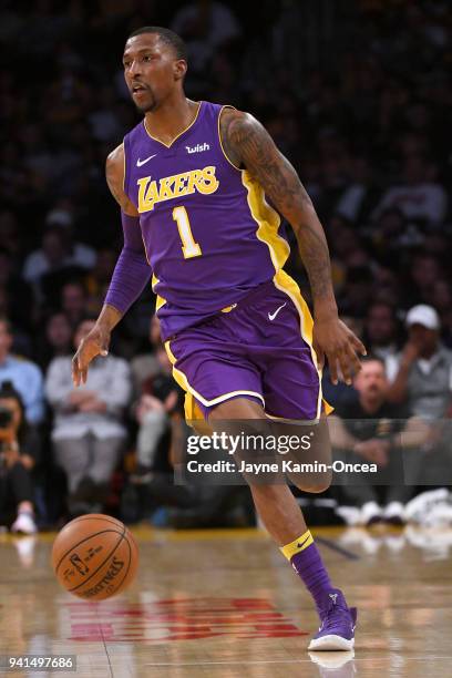 Kentavious Caldwell-Pope of the Los Angeles Lakers takes the ball down court in the game against the Dallas Mavericks at Staples Center on March 28,...