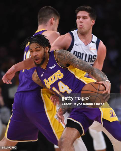 Doug McDermott of the Dallas Mavericks chases down Brandon Ingram of the Los Angeles Lakers in the game at Staples Center on March 28, 2018 in Los...