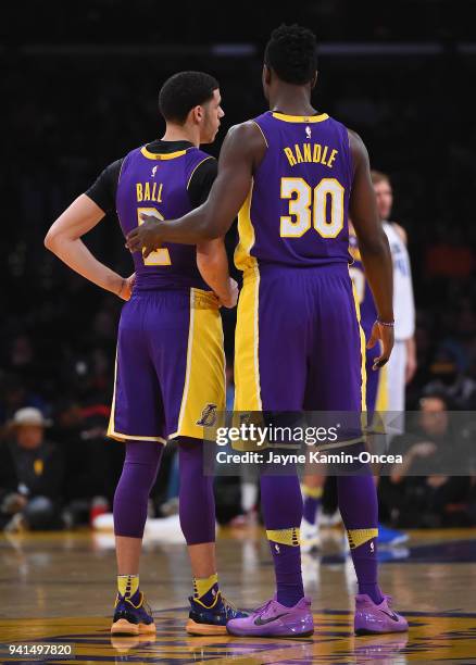Julius Randle and Lonzo Ball of the Los Angeles Lakers wait on the court during a time out in the game against the Dallas Mavericks at Staples Center...