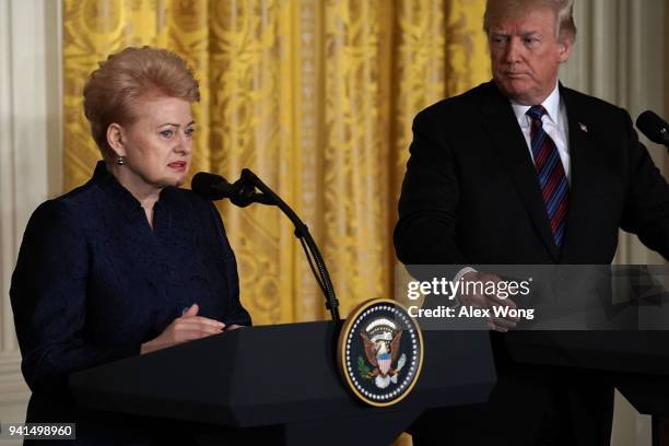 Lithuanian President Dalia Grybauskaite and U.S. President Donald Trump participate in a joint news conference in the East Room of the White House...