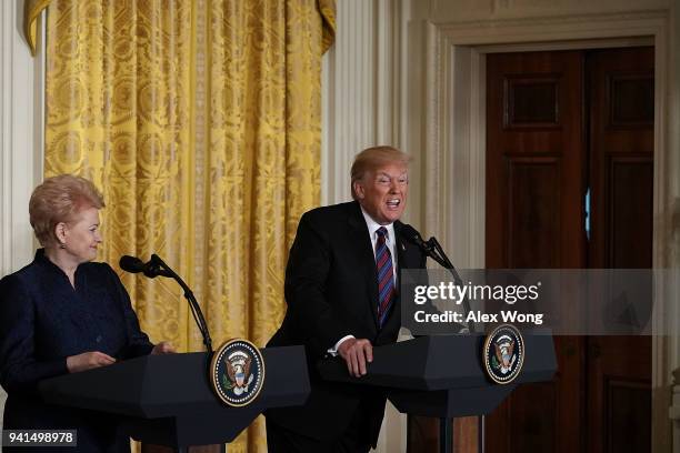 Lithuanian President Dalia Grybauskaite and U.S. President Donald Trump participate in a joint news conference in the East Room of the White House...