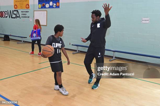 Patrick Beverley of the LA Clippers participates in the announcement of a major gift to renovate nearly 350 public basketball courts in the city at...