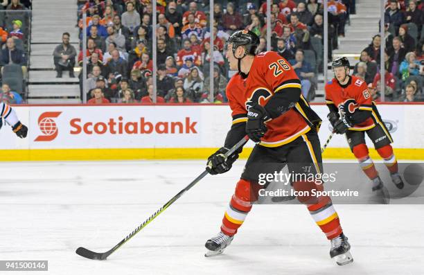 Calgary Flames Defenceman Michael Stone passes the puck with Calgary Flames Defenceman Brett Kulak during second period action against the Edmonton...