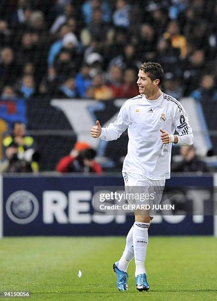 Real Madrid's Portuguese forward Cristiano Ronaldo celebrates after scoring against Olympique de Marseille during their UEFA Champions League...