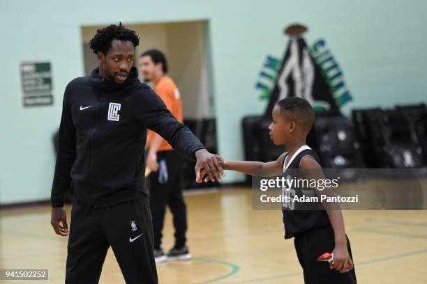 Patrick Beverley of the LA Clippers participates in the announcement of a major gift to renovate nearly 350 public basketball courts in the city at...