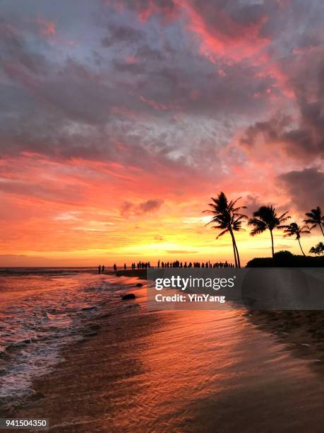 hawaiian sunset at poipu beach kauai - kauai stock pictures, royalty-free photos & images