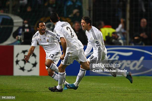 Cristiano Ronaldo of Real Madrid celebrates after scoring from a direct free kick during the Real Madrid UEFA Champions League Group C match between...