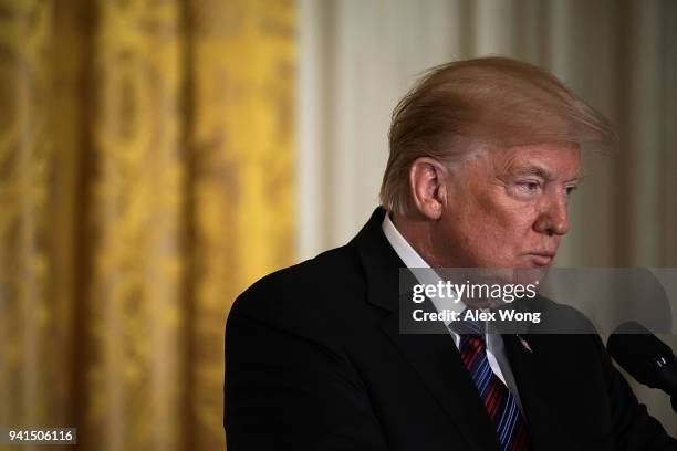 President Donald Trump listens during a joint news conference in the East Room of the White House April 3, 2018 in Washington, DC. Marking their...