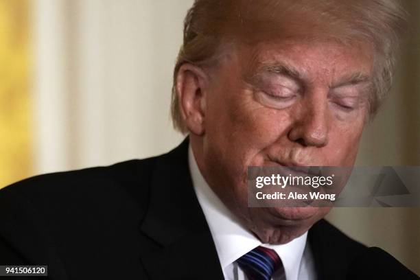 President Donald Trump listens during a joint news conference in the East Room of the White House April 3, 2018 in Washington, DC. Marking their...