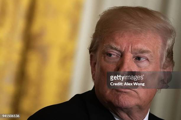 President Donald Trump listens during a joint news conference in the East Room of the White House April 3, 2018 in Washington, DC. Marking their...