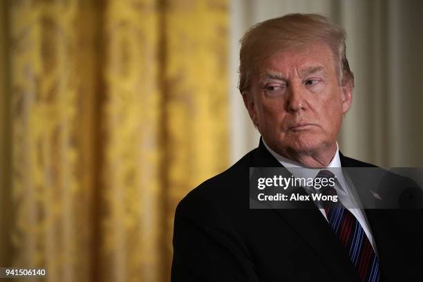 President Donald Trump listens during a joint news conference in the East Room of the White House April 3, 2018 in Washington, DC. Marking their...