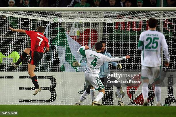 Michael Owen of Manchester heads the first goal past Marcel Schaefer, goalkeeper Diego Benaglio and Christian Gentner of Wolfsburg during the UEFA...