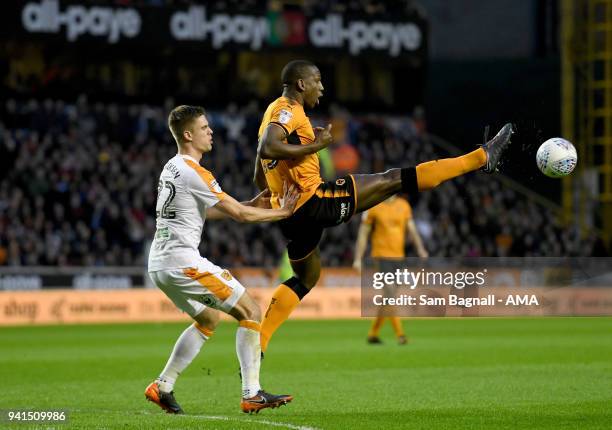 Markus Henriksen of Hull City and Willy Boly of Wolverhampton Wanderers during the Sky Bet Championship match between Wolverhampton Wanderers and...