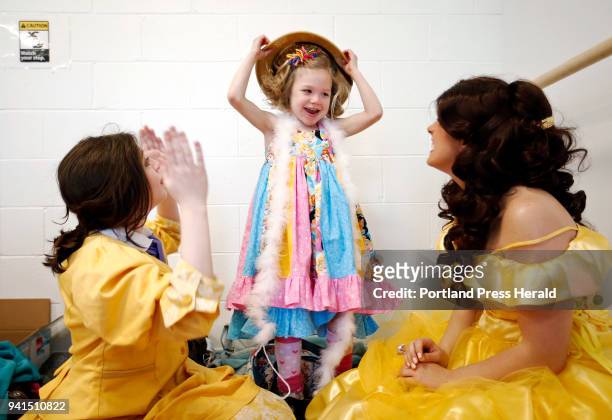 Katie Creedon of Buxton -- who has CDKL5 deficiency, a rare disease that affects fewer than 1,000 people in the world -- plays with a costume pith...