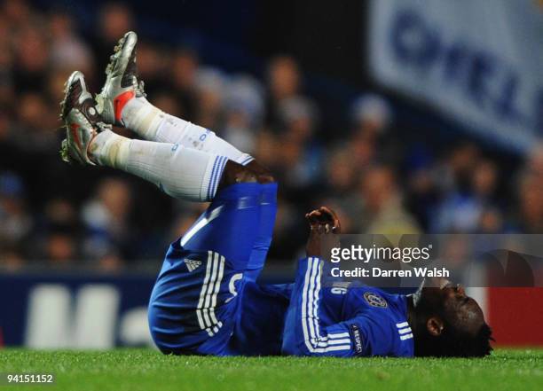 Michael Essien of Chelsea is injured during the UEFA Champions League Group D match between Chelsea and Apoel Nicosia at Stamford Bridge on December...