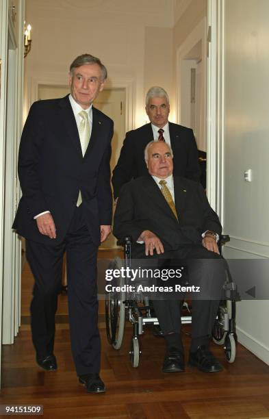 Former German Chancellor Helmut Kohl , is pushed by an assistant, and German President Horst Koehler arrive for a private dinner at Bellevue Pallace...