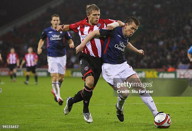 Jamie Ward of Sheffield United challenges Nicky Shorey of Nottingham Forest during the Coca-Cola Championship game between Sheffield United and...