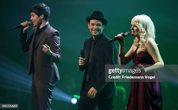 Vanessa, Roger Cicero and Leo singing during the TV Show 'Popstars You & I' semi final at the Koenigspilsener Arena on December 8, 2009 in...