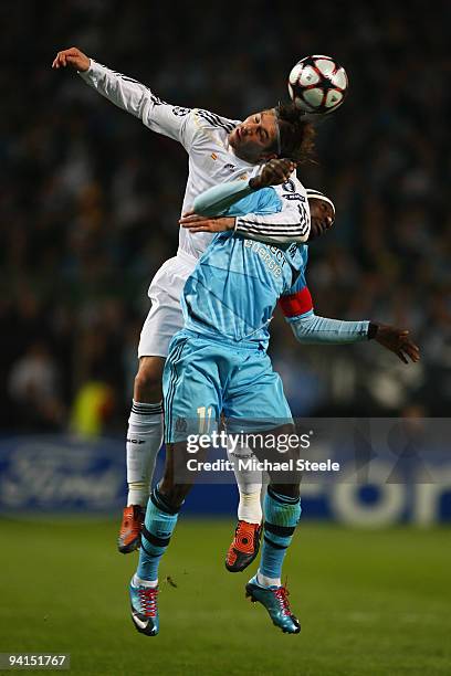 Sergio Ramos of Real rises above Mamadou Niang during the Marseille v Real Madrid UEFA Champions League Group C match at the Stade Velodrome on...