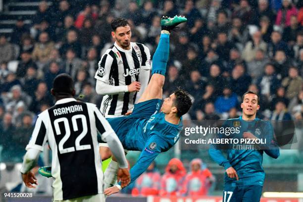 Real Madrid's Portuguese forward Cristiano Ronaldo overhead kicks and scores during the UEFA Champions League quarter-final first leg football match...