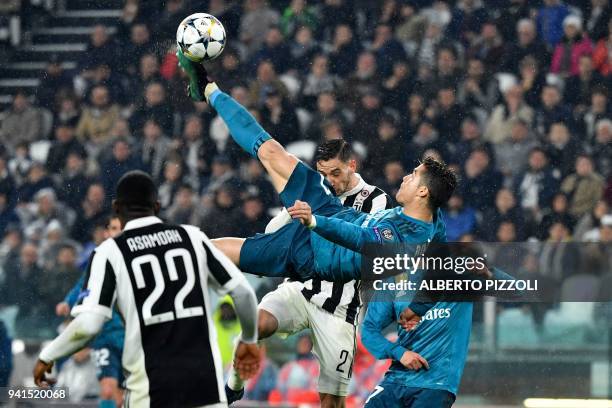 Real Madrid's Portuguese forward Cristiano Ronaldo overhead kicks and scores during the UEFA Champions League quarter-final first leg football match...