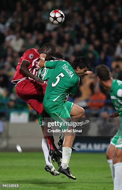 Jorge Teixeira of Maccabi Haifa and Abdou Traore of Bordeaux play the ball during their UEFA Champions League Group A matchday 6 game on December 8,...