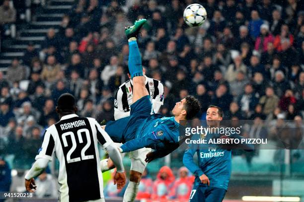 Real Madrid's Portuguese forward Cristiano Ronaldo overhead kicks and scores during the UEFA Champions League quarter-final first leg football match...
