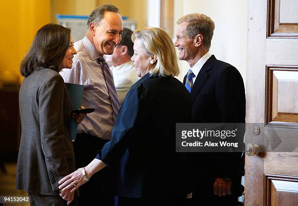 Sen. Maria Cantwell , Sen. Charles Schumer , Sen. Mary Landrieu , and Sen. Bill Nelson talk to each other prior to the weekly policy committee...