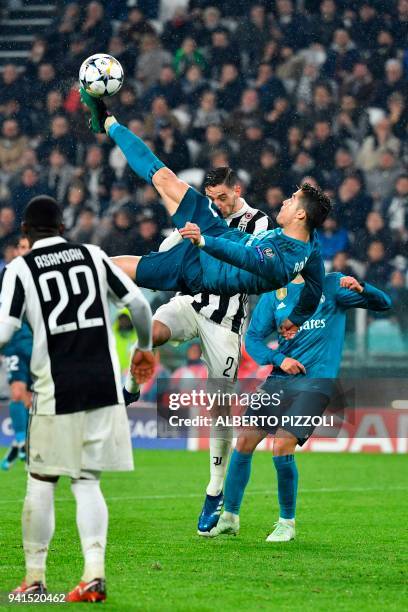 Real Madrid's Portuguese forward Cristiano Ronaldo overhead kicks and scores during the UEFA Champions League quarter-final first leg football match...