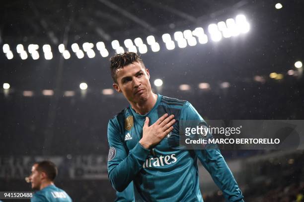 Real Madrid's Portuguese forward Cristiano Ronaldo celebrates his second goal during the UEFA Champions League quarter-final first leg football match...