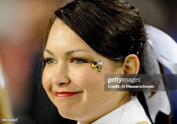 Cheerleader of the Georgia Tech Yellow Jackets watches play against the Clemson Tigers in the 2009 ACC Football Championship Game December 5, 2009 at...