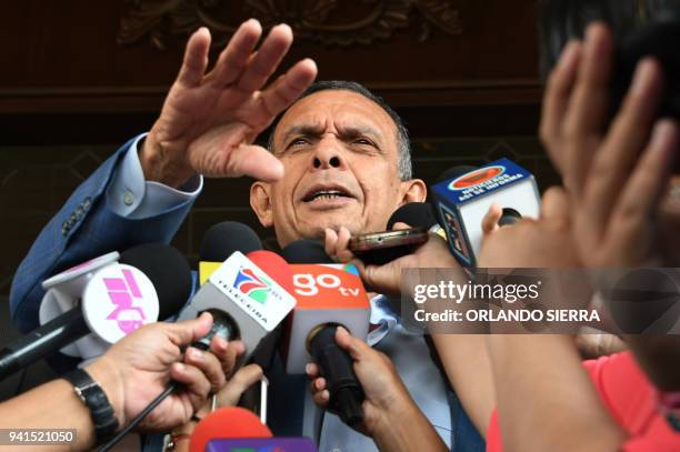 Former Honduran President Porfirio Lobo Sosa answers questions to the press after the arrival of the Administrative Office of Seized Assets to...