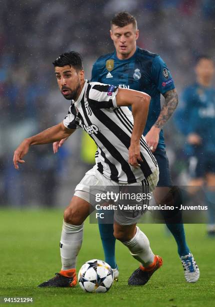 Sami Khedira of Juventus competes for the ball with Toni Kroos of Real Madrid during the UEFA Champions League Quarter Final Leg One match between...