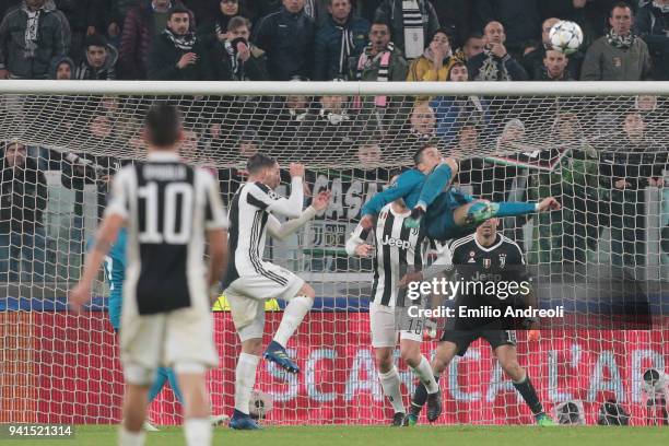 Cristiano Ronaldo of Real Madrid scores his sides second goal during the UEFA Champions League Quarter Final Leg One match between Juventus and Real...