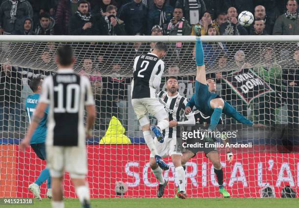 Cristiano Ronaldo of Real Madrid scores his sides second goal during the UEFA Champions League Quarter Final Leg One match between Juventus and Real...