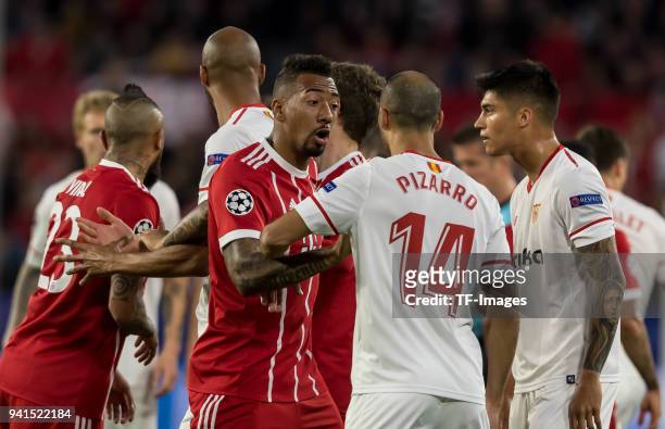 Jerome Boateng of Bayern Muenchen speak with Guido Pizarro of Sevilla during the UEFA Champions League Quarter-Final first leg match between Sevilla...