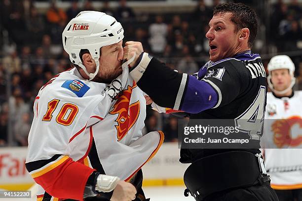 Raitis Ivanans of the Los Angeles Kings punches Brian McGrattan of the Calgary Flames during the game on December 7, 2009 at Staples Center in Los...